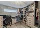 Well-organized closet and office features custom shelving, ample storage space, and a dedicated workstation at 8137 E Indian School Rd, Scottsdale, AZ 85251