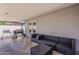 Relax in the covered patio area, complete with outdoor seating and a grill for ultimate outdoor enjoyment at 8137 E Indian School Rd, Scottsdale, AZ 85251