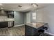 Modern kitchen with sleek cabinetry, stainless steel appliances, and a convenient breakfast bar at 8137 E Indian School Rd, Scottsdale, AZ 85251