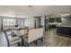 Open-concept layout with modern kitchen, dining area, and comfortable seating at 8137 E Indian School Rd, Scottsdale, AZ 85251