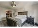 Main bedroom with a walk-in closet, a ceiling fan, and hardwood floors at 8137 E Indian School Rd, Scottsdale, AZ 85251