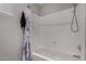 Clean bathroom features a bathtub and shower with white shower surround and silver fixtures at 8720 W Willowbrook Dr, Peoria, AZ 85382