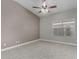 Spacious bedroom with plush carpet, ceiling fan, and large window providing natural light at 8720 W Willowbrook Dr, Peoria, AZ 85382