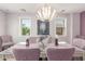 Formal dining room with chandelier, decorative table setting and lots of natural light at 905 S Osborn Ln, Gilbert, AZ 85296
