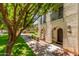 Charming home exterior with landscaped walkway leading to inviting front door with wrought iron balconies at 905 S Osborn Ln, Gilbert, AZ 85296