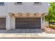 Exterior shot of a two-car garage with decorative details and driveway at 905 S Osborn Ln, Gilbert, AZ 85296