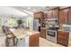 Bright kitchen featuring stainless steel appliances, breakfast bar and granite countertops at 905 S Osborn Ln, Gilbert, AZ 85296