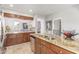 Modern kitchen with stainless steel appliances, granite countertops and tile flooring at 905 S Osborn Ln, Gilbert, AZ 85296
