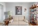 Comfortable living room with decoratively displayed personal items and a vintage-style side table at 905 S Osborn Ln, Gilbert, AZ 85296