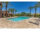 Resort-style community pool with ample lounge seating, palm trees, and well-maintained landscaping at 905 S Osborn Ln, Gilbert, AZ 85296