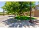 Street corner of a home exterior showing professionally landscaped lawn, sidewalks, and tall shade trees at 905 S Osborn Ln, Gilbert, AZ 85296
