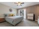 Bright bedroom with a sliding glass door to the outside, contemporary furnishing, and ceiling fan at 932 W Julie Dr, Tempe, AZ 85283
