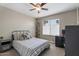 Cozy bedroom featuring a patterned bedspread, desk, and streamlined contemporary design at 932 W Julie Dr, Tempe, AZ 85283