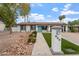 Inviting front exterior showcasing a walkway, manicured landscaping, and address marker at 932 W Julie Dr, Tempe, AZ 85283