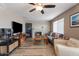 Comfortable living room featuring a cozy fireplace, wood floors, and ample seating at 932 W Julie Dr, Tempe, AZ 85283