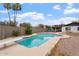 Backyard featuring an in-ground pool and desert landscaping, perfect for outdoor relaxation at 932 W Julie Dr, Tempe, AZ 85283
