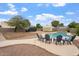 Backyard featuring a refreshing in-ground pool, comfortable chairs, and desert landscaping at 932 W Julie Dr, Tempe, AZ 85283