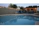 Inviting pool area with string lights and comfortable blue chairs for relaxing evenings at 932 W Julie Dr, Tempe, AZ 85283