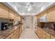 Well-lit kitchen featuring sleek appliances and plenty of cabinet space, offering functionality at 10439 W Kingswood Cir, Sun City, AZ 85351