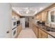 Spacious kitchen with ample counter space and modern appliances, ideal for cooking enthusiasts at 10439 W Kingswood Cir, Sun City, AZ 85351
