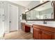 Bathroom with double vanity, custom mirror, new shower and white interior doors at 1229 W Sycamore Rd, Queen Creek, AZ 85140