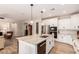 Spacious kitchen featuring a large island, white cabinets, and stainless steel appliances at 1229 W Sycamore Rd, Queen Creek, AZ 85140