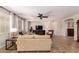 Bright living room with hardwood floors, comfortable furniture, and recessed lighting at 1229 W Sycamore Rd, Queen Creek, AZ 85140
