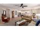 Spacious open-concept living room featuring hardwood floors and a view of the kitchen at 1229 W Sycamore Rd, Queen Creek, AZ 85140