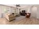 Spacious living room featuring neutral tones, natural light, and modern ceiling fan at 1229 W Sycamore Rd, Queen Creek, AZ 85140