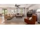 Cozy living room with hardwood floors, neutral furniture, and lots of natural light at 1229 W Sycamore Rd, Queen Creek, AZ 85140