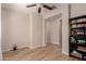 Study room featuring a large bookshelf and hardwood floors at 1229 W Sycamore Rd, Queen Creek, AZ 85140