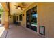 View of the outdoor patio with ceiling fans and access to the backyard pool, perfect for relaxation at 1229 W Sycamore Rd, Queen Creek, AZ 85140