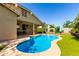 Sparkling backyard swimming pool set against a lush landscape, offering a private retreat for relaxation at 1229 W Sycamore Rd, Queen Creek, AZ 85140