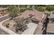 Aerial view of a tile roof home with desert landscaping and a paved driveway at 12360 W Eagle Ridge Ln, Peoria, AZ 85383