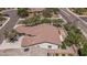 Aerial view of a single-story home showcasing artificial turf and desert landscaping at 12360 W Eagle Ridge Ln, Peoria, AZ 85383
