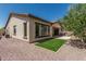 Backyard featuring a tiled roof, stucco exterior, and an outdoor grill at 12360 W Eagle Ridge Ln, Peoria, AZ 85383