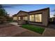 This backyard features a built-in stainless steel grill, outdoor lighting, and artificial turf at 12360 W Eagle Ridge Ln, Peoria, AZ 85383