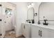 Modern bathroom with double vanity, sleek black fixtures, and a shower at 12360 W Eagle Ridge Ln, Peoria, AZ 85383