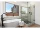 Modern bathroom with soaker tub and walk-in shower with glass door at 12360 W Eagle Ridge Ln, Peoria, AZ 85383