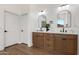 Bathroom with double wood vanities and white counter tops at 12360 W Eagle Ridge Ln, Peoria, AZ 85383