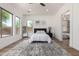 Spacious bedroom showcasing the beautiful wood flooring, natural light, and interior design at 12360 W Eagle Ridge Ln, Peoria, AZ 85383