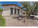 Close up of a single story home with 3 windows and desert landscaping at 12360 W Eagle Ridge Ln, Peoria, AZ 85383