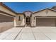 Single story home with a private courtyard entrance between two garages at 12360 W Eagle Ridge Ln, Peoria, AZ 85383