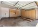 Spacious garage with abundant built-in storage cabinets and an automatic door at 12360 W Eagle Ridge Ln, Peoria, AZ 85383