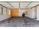 Clean garage interior showcasing the water tank, filtration system, and cabinetry at 12360 W Eagle Ridge Ln, Peoria, AZ 85383