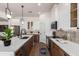 Bright eat-in kitchen boasts a center island, modern stainless appliances, and stylish cabinetry at 12360 W Eagle Ridge Ln, Peoria, AZ 85383