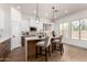 Bright kitchen features an island with barstools, pendant lighting, and ample counter space at 12360 W Eagle Ridge Ln, Peoria, AZ 85383