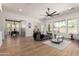 Spacious living room with wood floors, large windows and contemporary decor at 12360 W Eagle Ridge Ln, Peoria, AZ 85383