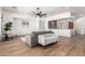 Bright living area with modern furnishings, wood floors, and an open flow into other rooms at 12360 W Eagle Ridge Ln, Peoria, AZ 85383