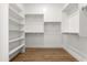 Spacious walk-in closet with ample shelving and wood-look flooring at 12360 W Eagle Ridge Ln, Peoria, AZ 85383